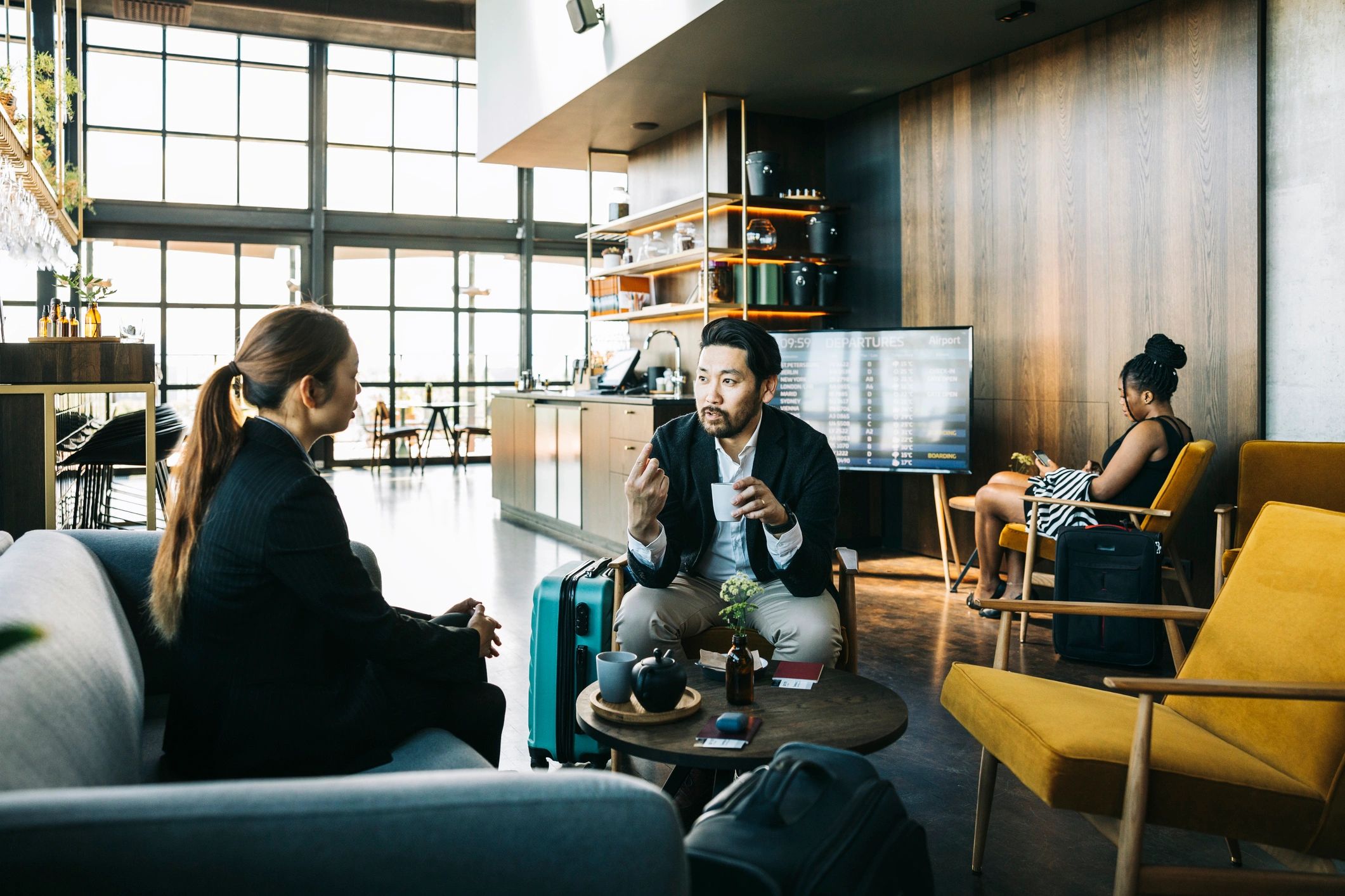 Businesspeople waiting in an airport business lounge