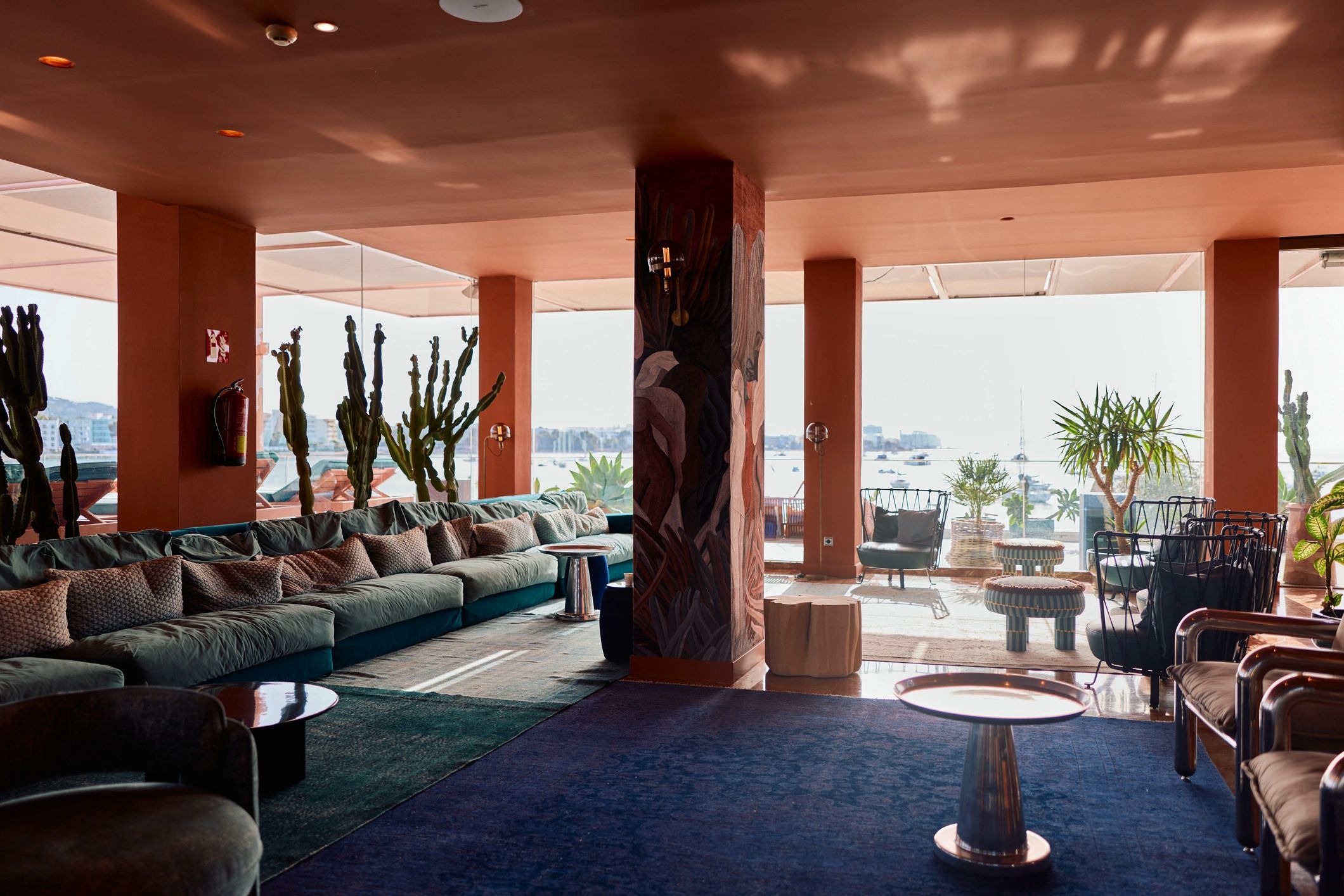 Modern luxury resort lobby with refined seating and ocean view